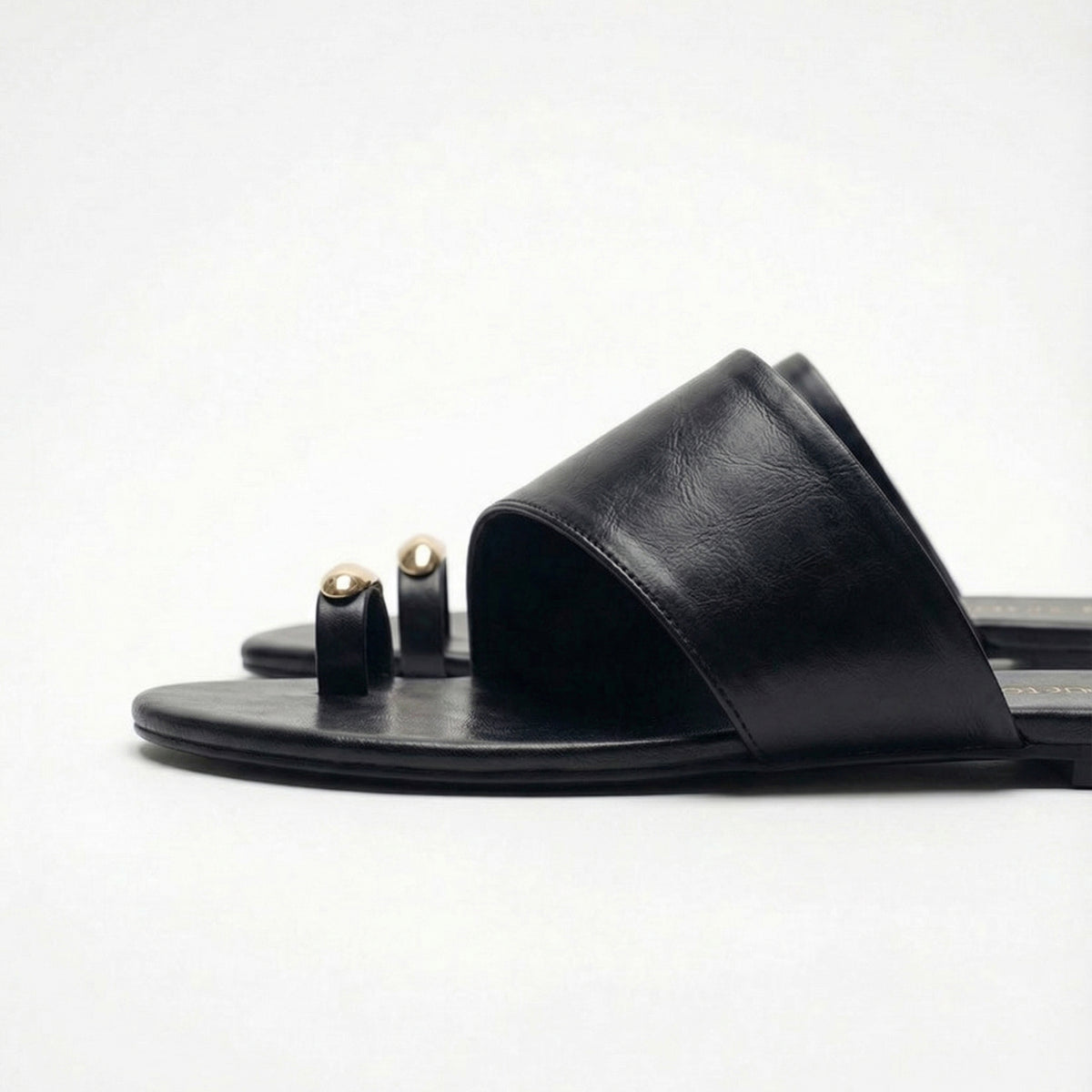 Black metal detail toe ring flats