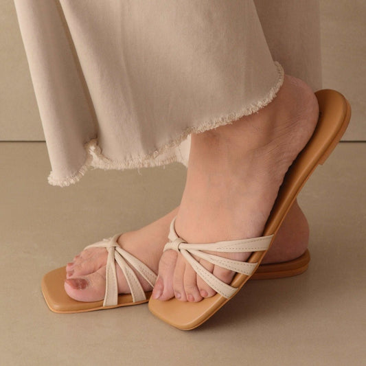 Tied in off white flats