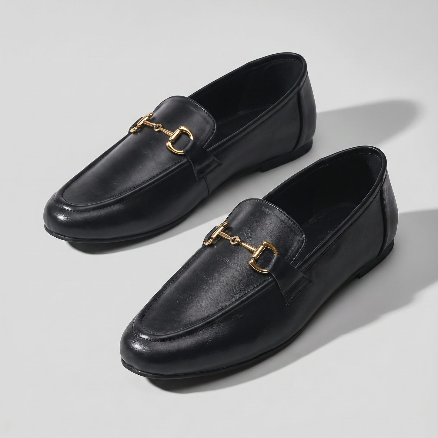 Aura black loafers with antique gold Buckle