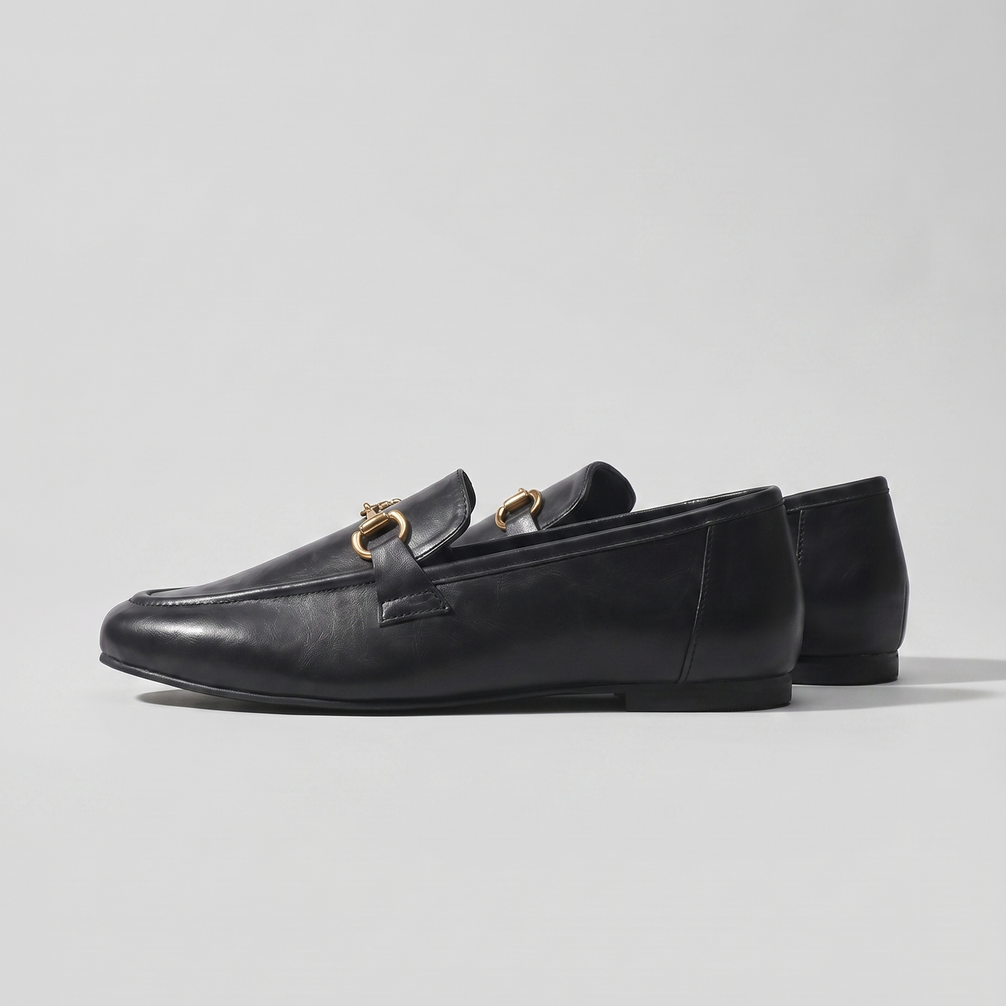 Aura black loafers with antique gold Buckle