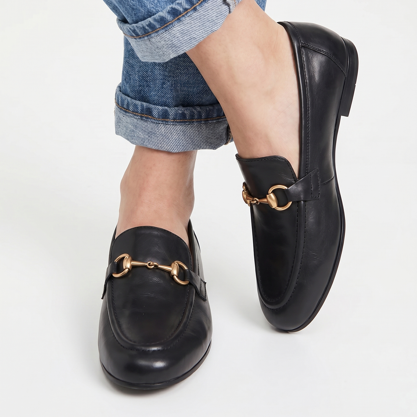 Aura black loafers with antique gold Buckle